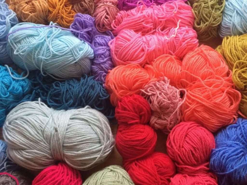 Stash of spare yarn being sorted for next crochet project