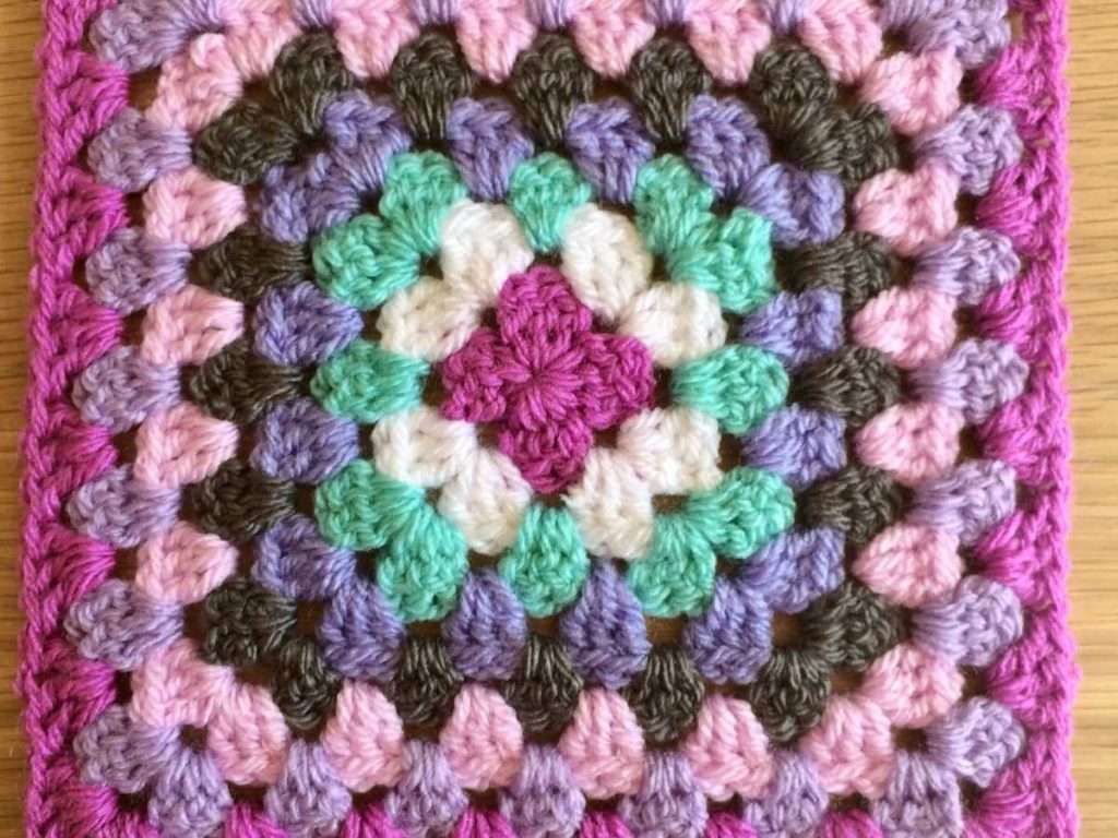 Beginning the Amethyst Granny Square Blanket with the first 8 rounds