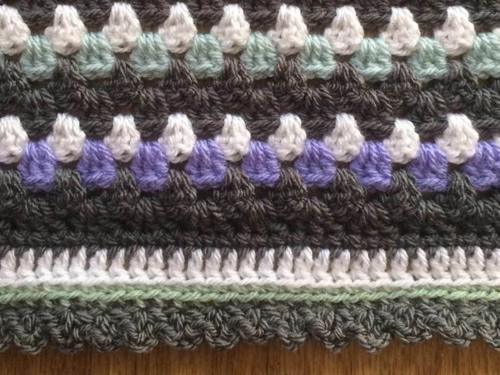 Close up of a crochet border for a giant granny square blanket