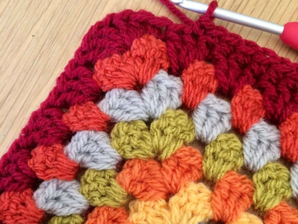 Working the first round of the border on the Autumn Granny Square blanket