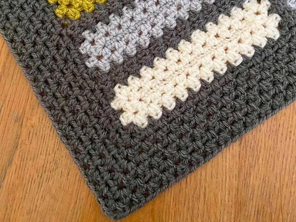 Close up of crochet blanket to show the border at the corner