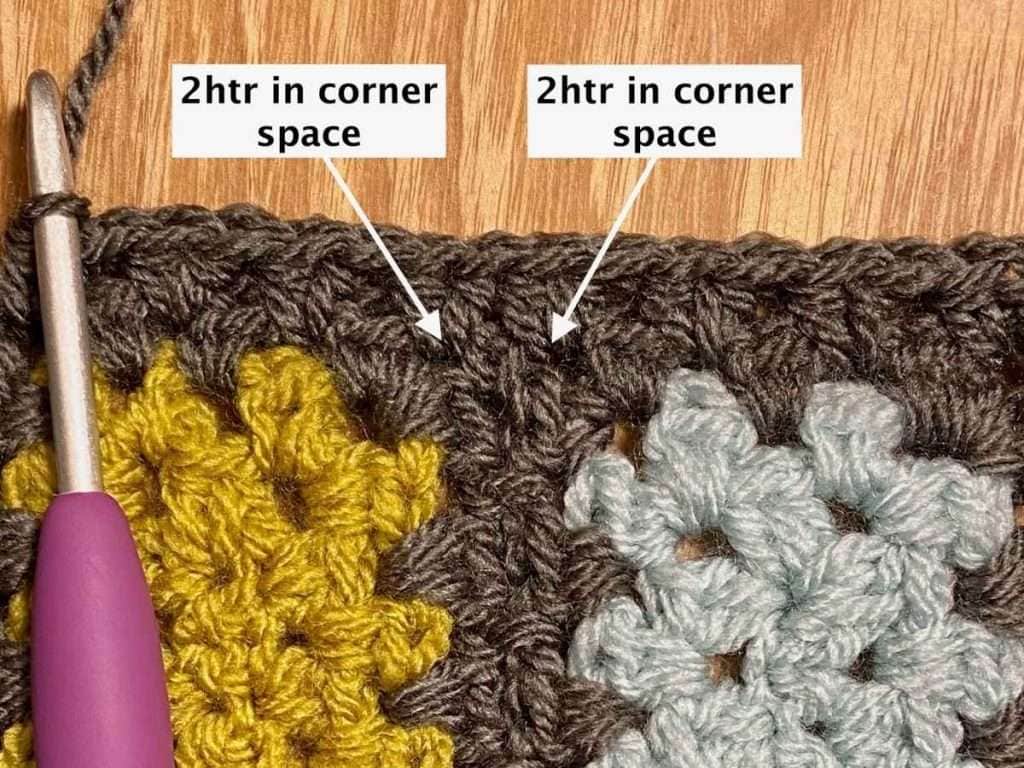 Close up of working the crochet border around the rectangle blanket