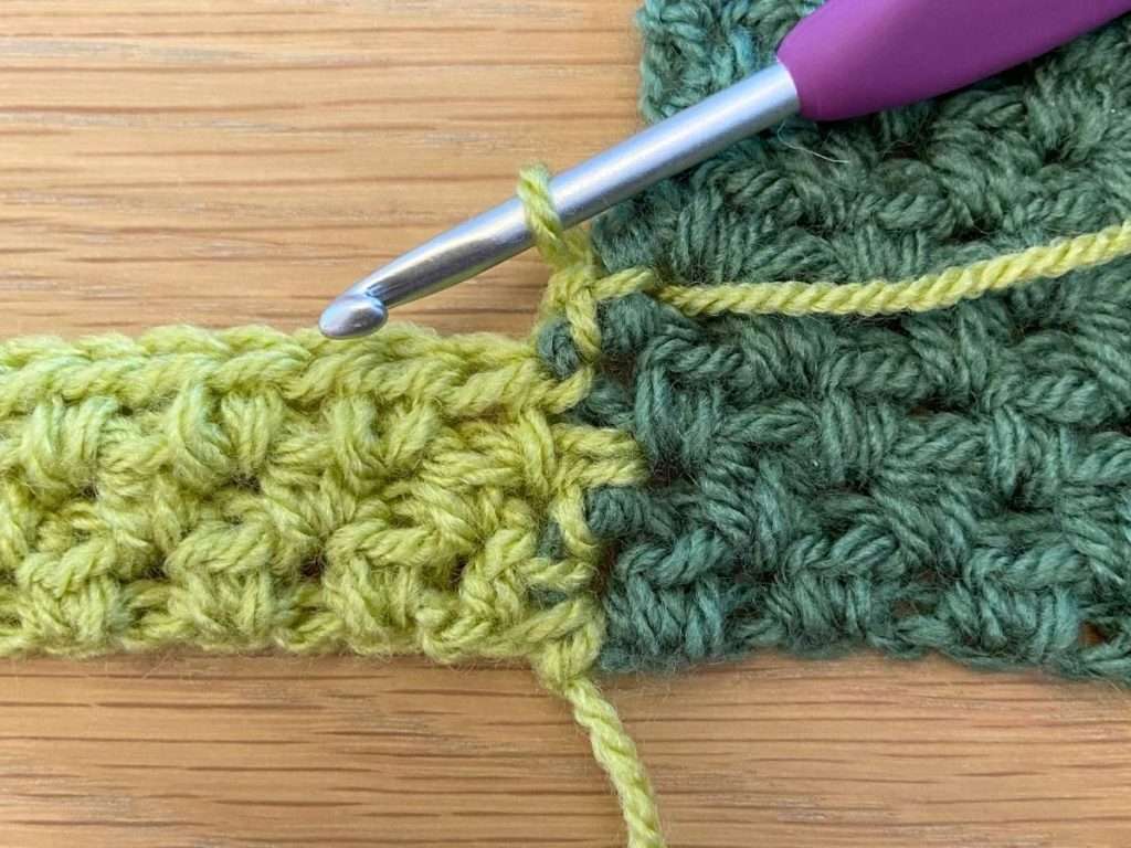Close up view of the reverse side of a crochet project