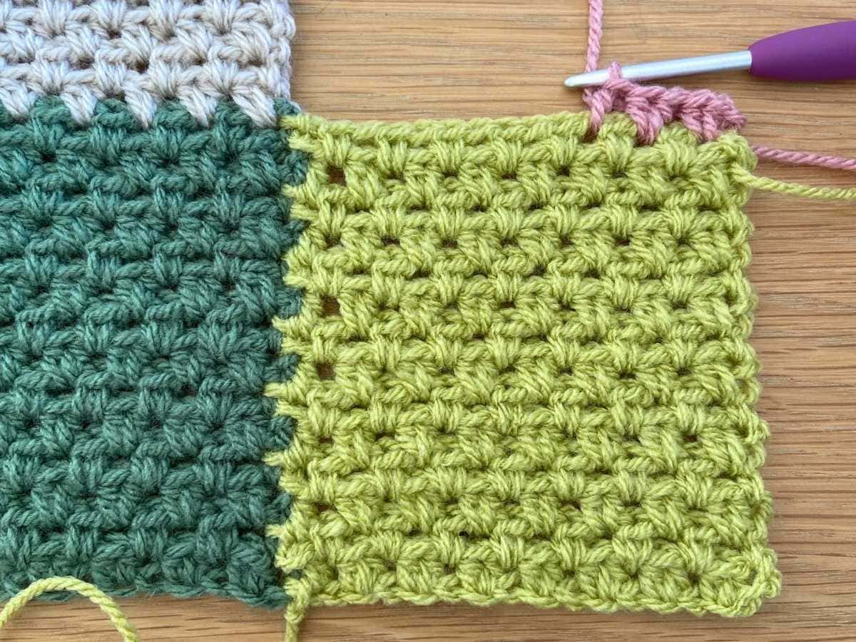 New row of crochet in pink yarn