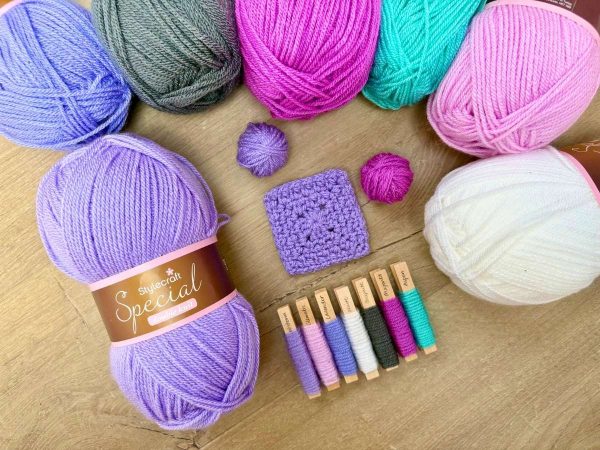 Pretty coloured yarn arranged on a table